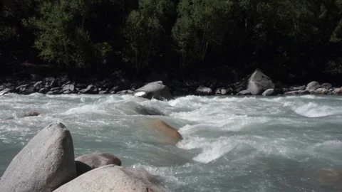 Water is flowing through the rocks in a river valley - ecology, fresh water, ... Stock Footage 260894937