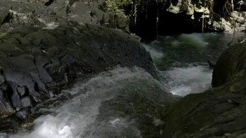 Water flowing through Rocks in slow motion Stock Footage 74906962