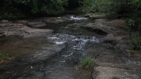 Water Flowing through rocks at Stone Creek Park in Flower Mound Texas. Stock Footage 66790554