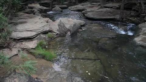 Water Flowing through rocks at Stone Creek Park in Flower Mound Texas. Stock Footage 66790581