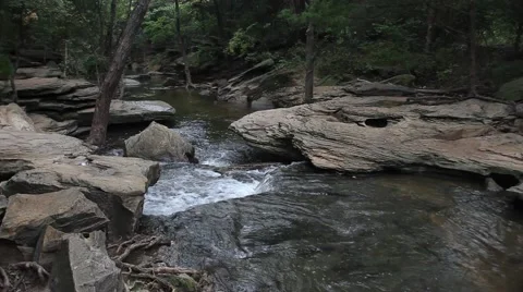 Water Flowing through rocks at Stone Creek Park in Flower Mound Texas. Stock Footage 66790642