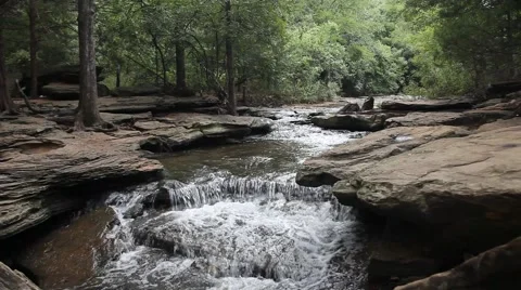 Water Flowing through rocks at Stone Creek Park in Flower Mound Texas. Stock Footage 66790655