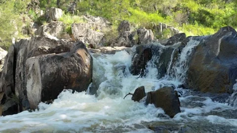 Water flowing into the top of a waterfall Video stock 163808982