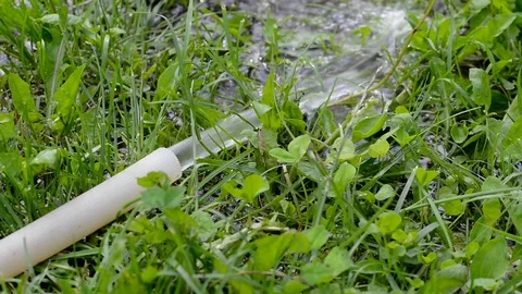 Water flowing trough plastic hose Stock Footage 110890519