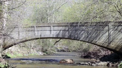 Water flowing under bridge Stock Footage 44347065