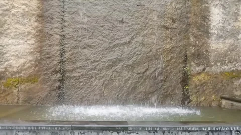 Water flowing on the wall Stock Footage 297594224