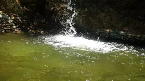 Water flowing into the water Video stock 158058327