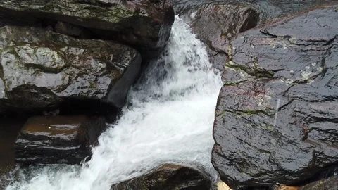 Water flowing in waterfall in slow motion hd Stock Footage 210237098
