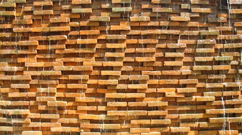 Water flows along a stone wall Stock Footage 35378065
