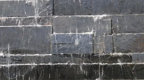 Water flows along a stone wall Stock-Footage 50579356