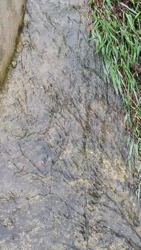 Water flows between 2 hills Stock Footage 301417975