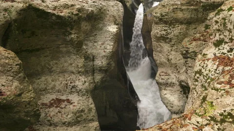 Water flows between big white stones in national park White Rocks Canyon Stock Footage 220497202