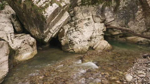Water flows between big white stones in national park White Rocks Canyon Video stock 220499390
