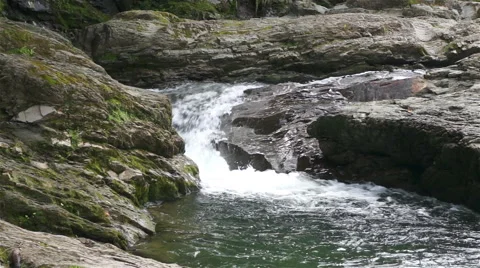 Water flows between the rocks in the mountains Stock-Footage 41257633