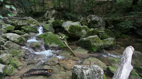 Water flows between stones in wild nature 動画素材 35465010