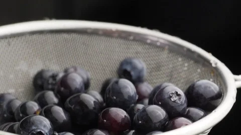 Water flows on blueberry Stock Footage 84976960