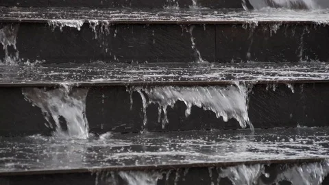 Water flows in the city. Close-up of waterfall on a fountain. Waters running Stock Footage 124782828