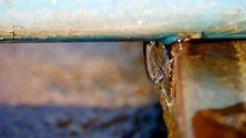 Water flows from the cracks of the pipe. Stock Footage 104203831