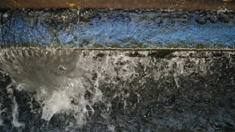 Water flows into the dam. Slow motion Video stock 205853741