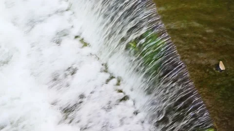 Water flows down from a concrete sewer drain. Sewage in the city. Sewage water Stock Footage 222619055