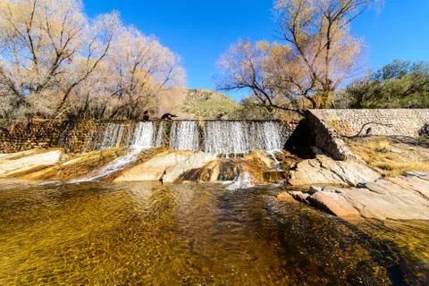 Water flows down a dam Stock Photos