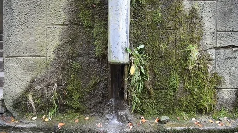 Water flows down the drain pipe. Stock Footage 121658495