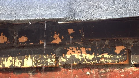 Water flows down a red brick wall Stock Footage 124760505