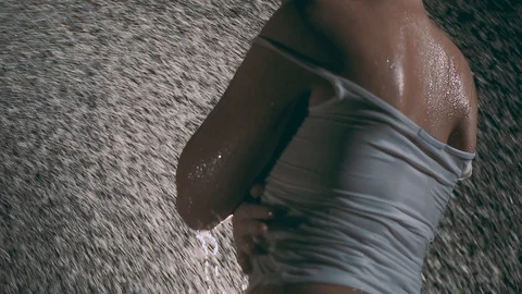 Water flows down the red-haired girl in the shower. The girl under the streams Video stock 89500062