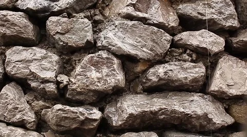 Water flows down the rock wall Stock Footage