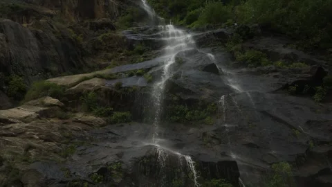 Water flows down the rocks from above Stock Footage 278095216