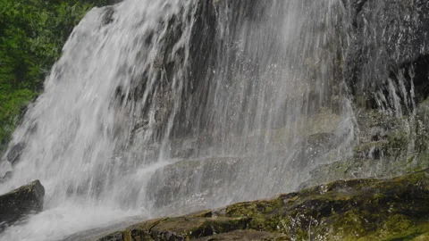 Water Flows Down the Rocky Slope from mountain source to River Stock Footage 149787774