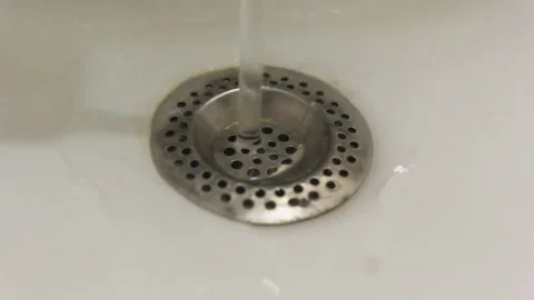 Water flows down to the sink on the filter. Stock Footage 167584378