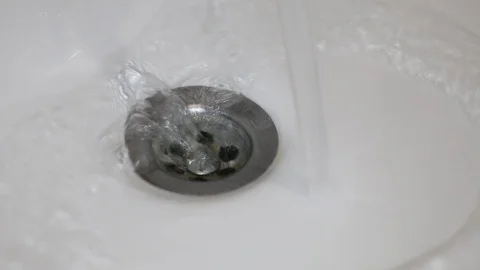 Water flows down the sink Stock Footage 113010492