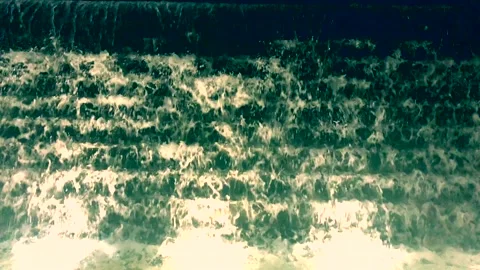 Water flows down the stairs. Background of water Stock Footage 106328881