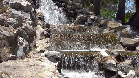 Water flows down the steps in a waterfall Stock Footage 121653349