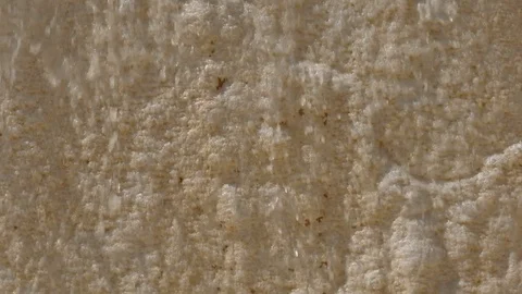 Water flows down stream in brown travertine in Pamukkale. Stock Footage 120456406
