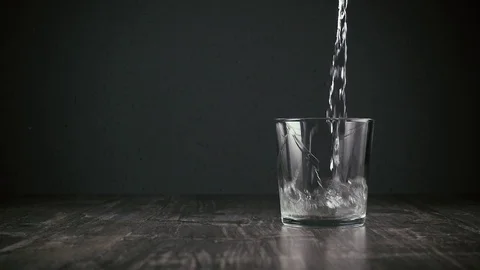 Water flows into the glass Stock Footage 94668290