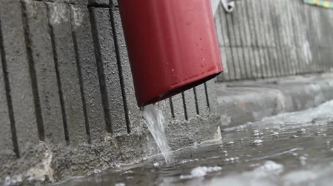 Water flows from the gutter. Spring. Stock Footage 47131059