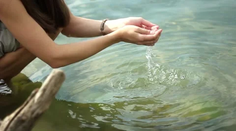 Water flows in the hands Stock Footage 66527818