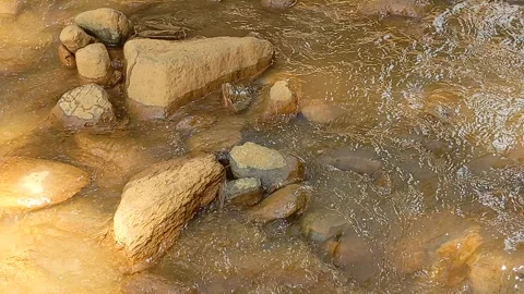 Water flows from the hill Stock Footage 292565957