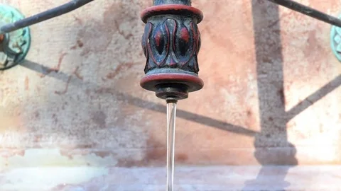 Water flows from historical tap Stock Footage 70453053