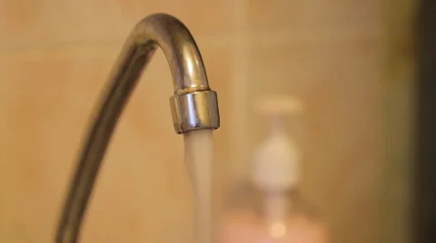 Water flows from the kitchen faucet Stock Footage 49545907
