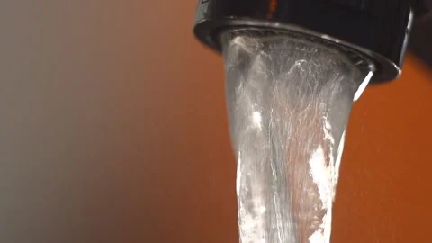 Water flows from the kitchen faucet. Macro. Slow motion 库存影片 87119022