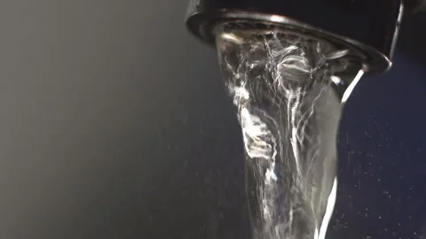 Water flows from the kitchen faucet. Macro. Slow motion Stock Footage 87119176