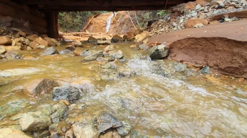 Water flows from the mountain down Stock Footage 295928493