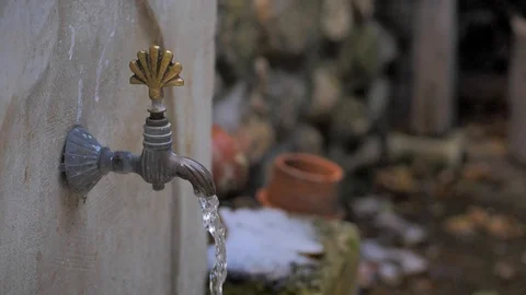 Water flows from an old stone crane in oriental style. close-up 스톡 동영상 124689313