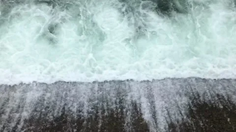 Water flows out of the dam Stock Footage 132376725