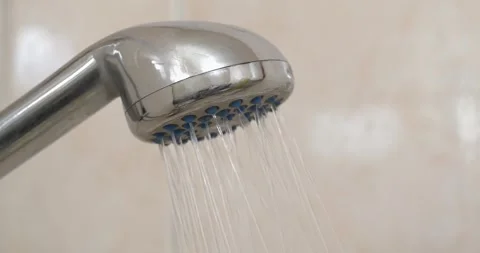 Water flows out of shower head with sound. Shower head in bathroom,chrome faucet Stock-Footage 316501789