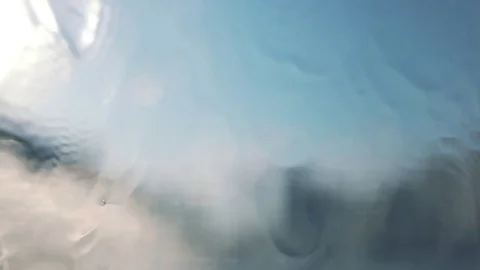 The water flows over the glass surface, rain. Stock Footage 79643173