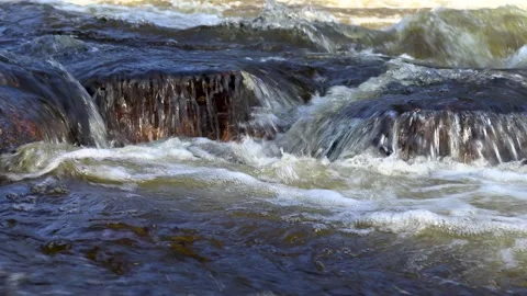 Water flows over rocks, waterfall. Stock Footage 241533421